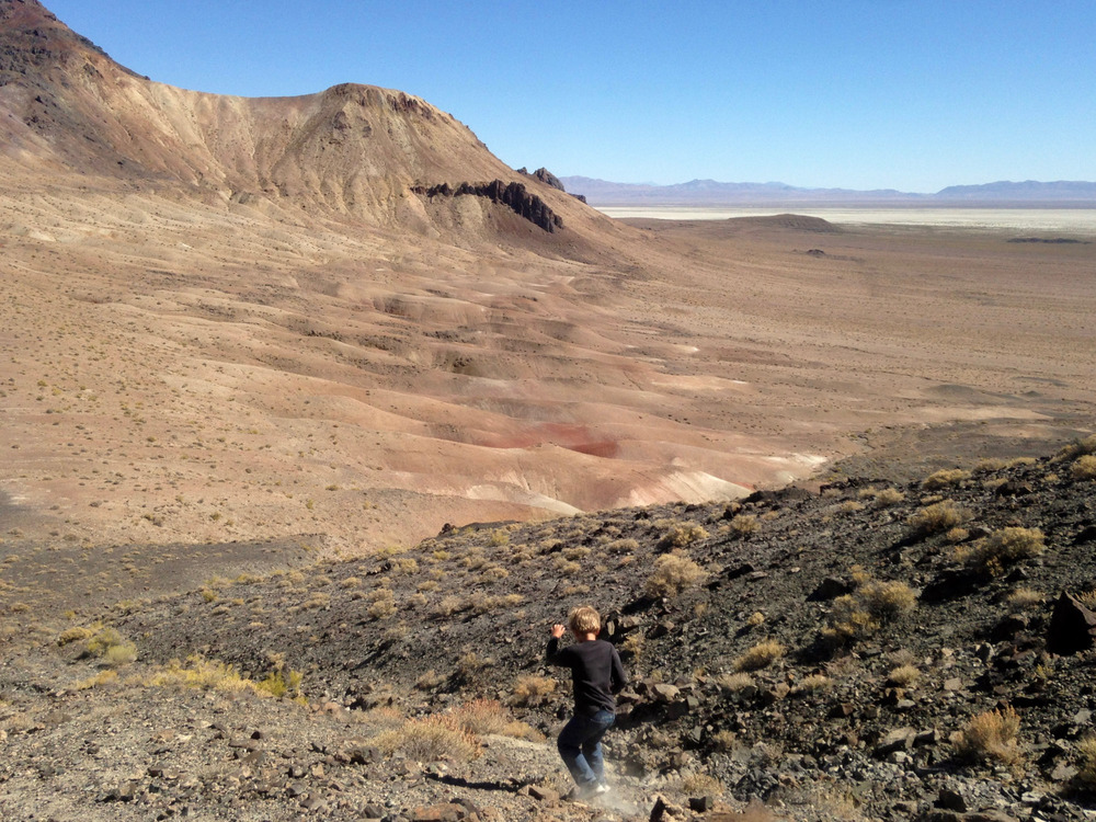 boy sliding down the shale slope