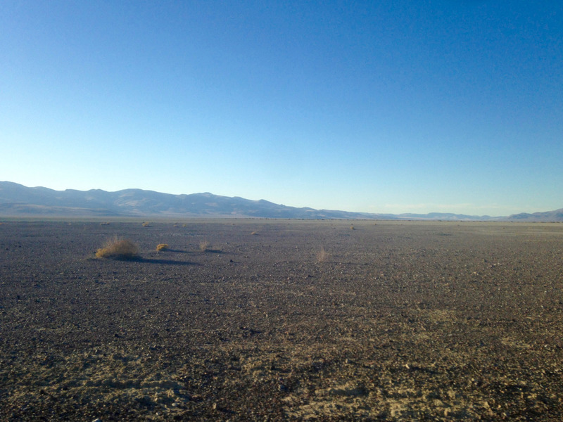 flat expanse of dark sand