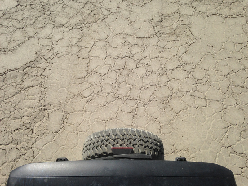 Jeep tire against the dry lakebed