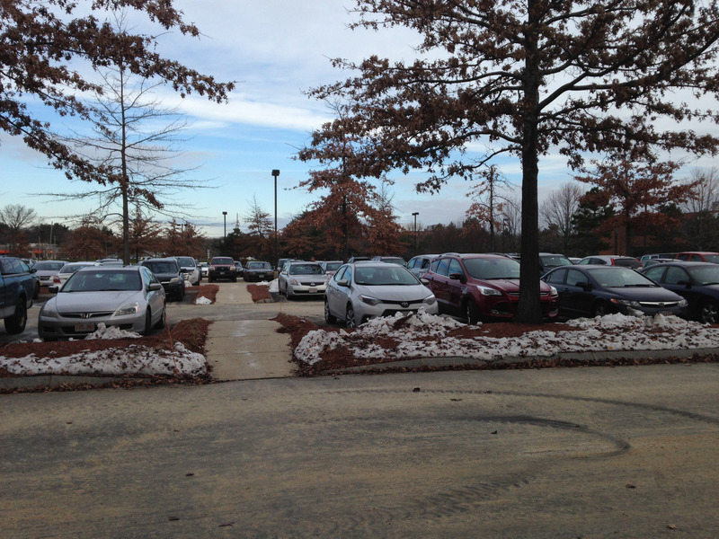 parking lot with a light dusting of snow