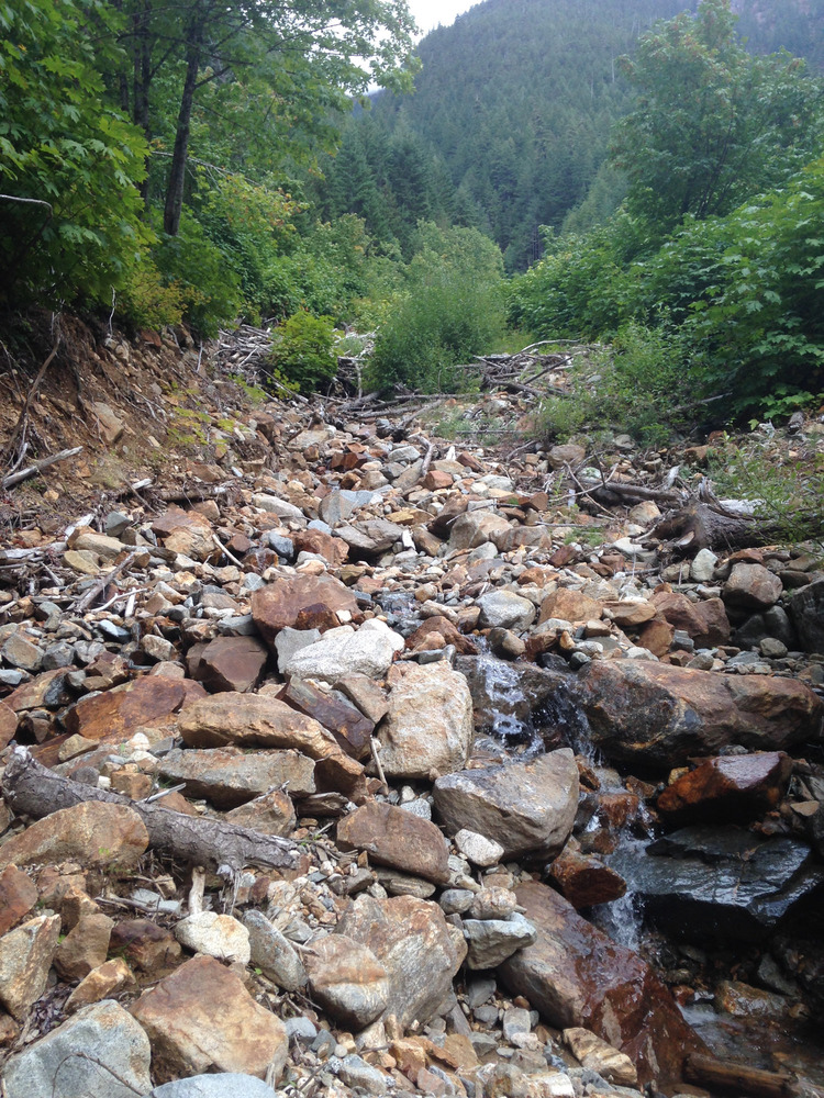 water tumbling down small boulders