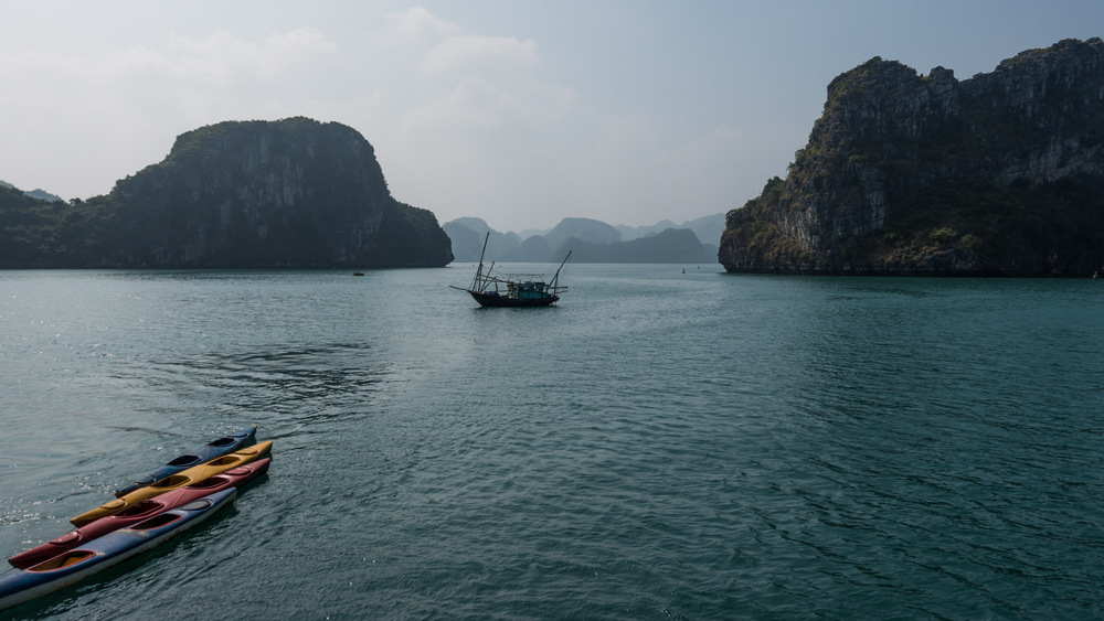 kayaks and fishing boat on the water