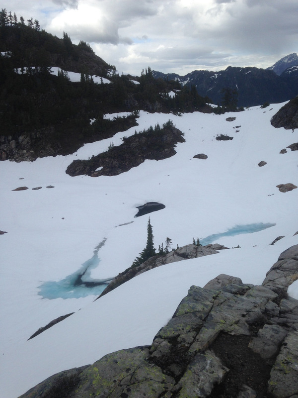 frozen pond covered in snow