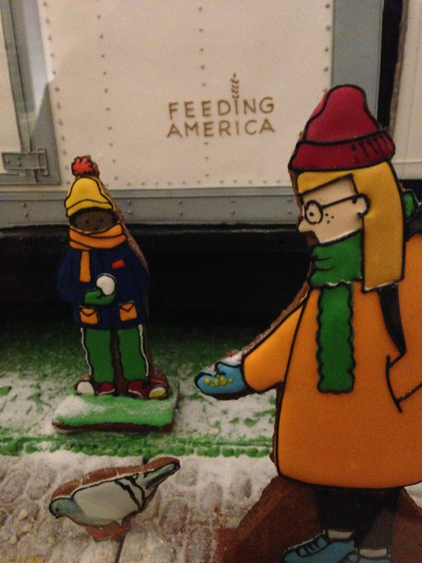 gingerbread person standing in front of a truck