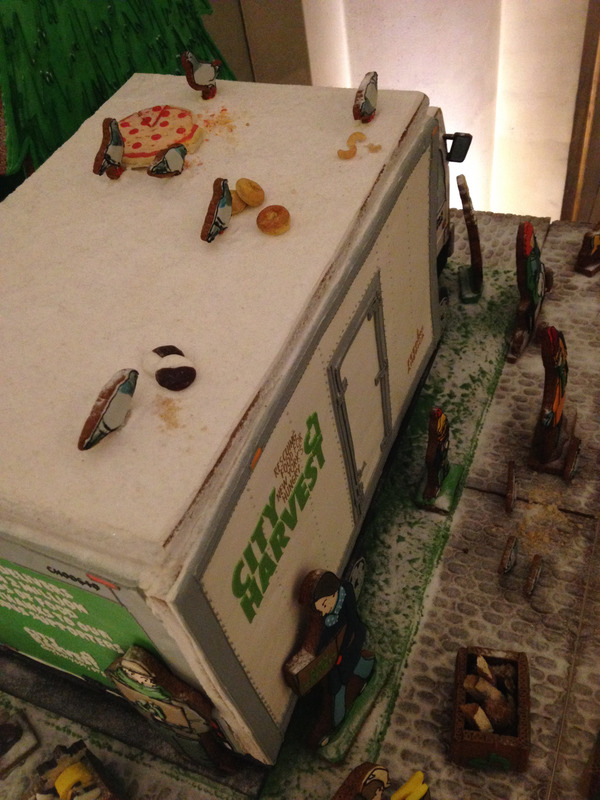 candy pigeons on top of a gingerbread truck