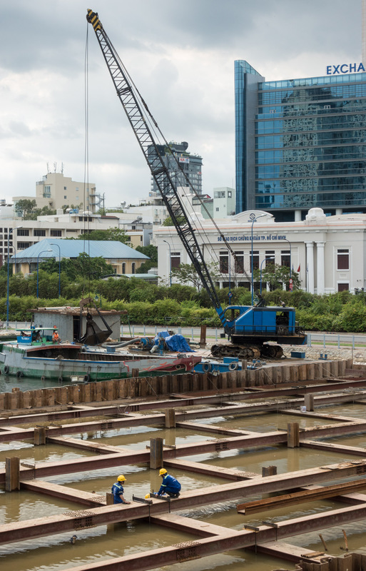 workers dredging the river