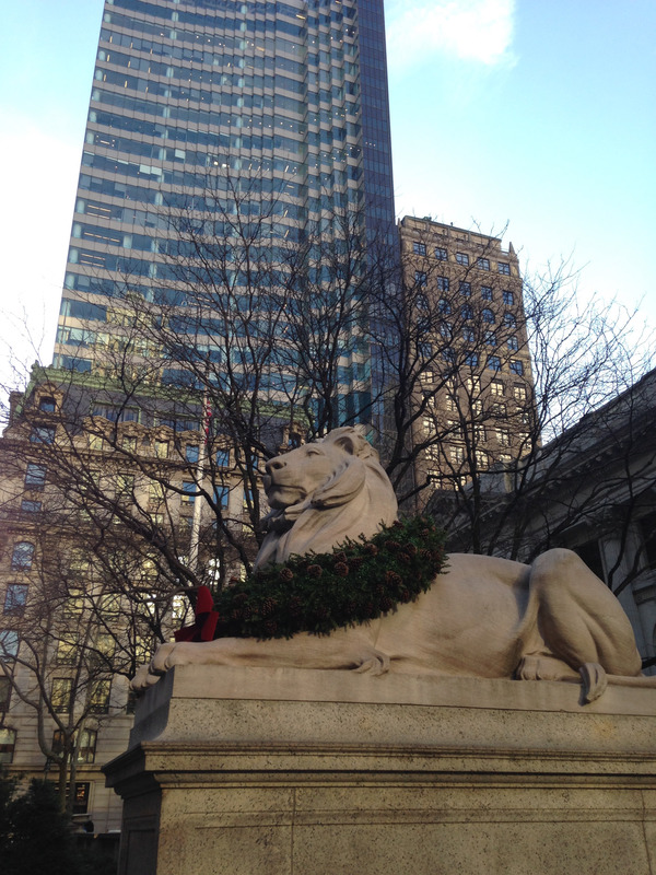 lion statue in front of the library