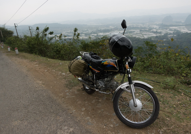 motorbike parked overlooking a valley