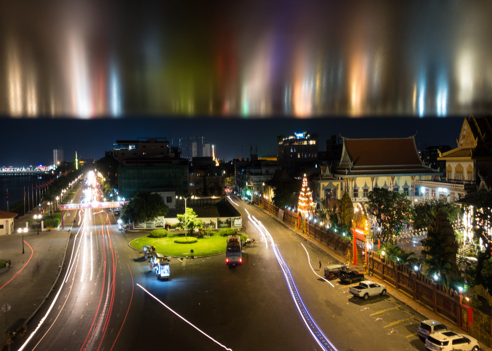 reflected traffic light trails above Sisowath Quay