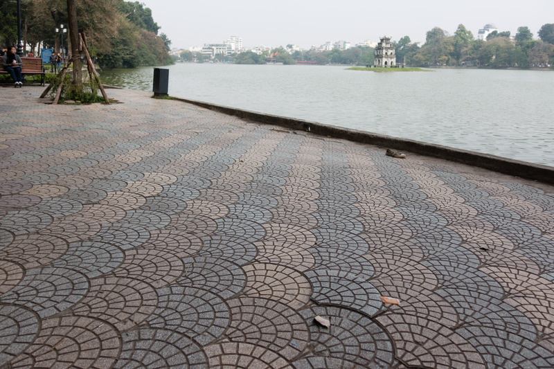 curved pavers surrounding Hoan Kiem
