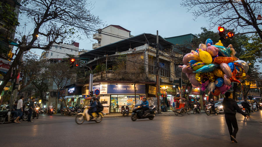 woman selling balloon in the intersection