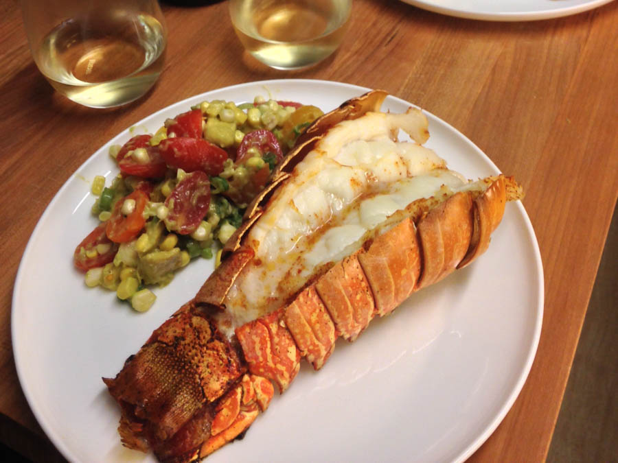 cooked and plated lobster and salad