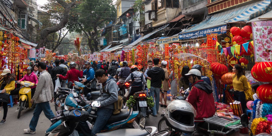people shopping in the colorful Tet market