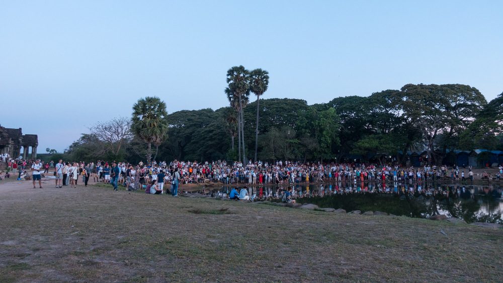 people taking sunrise pictures at Angkor Wat