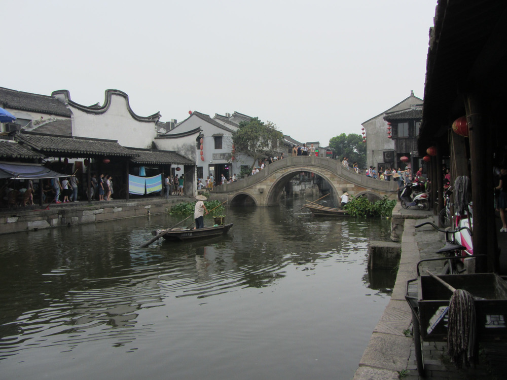 arched bridge and a boatman