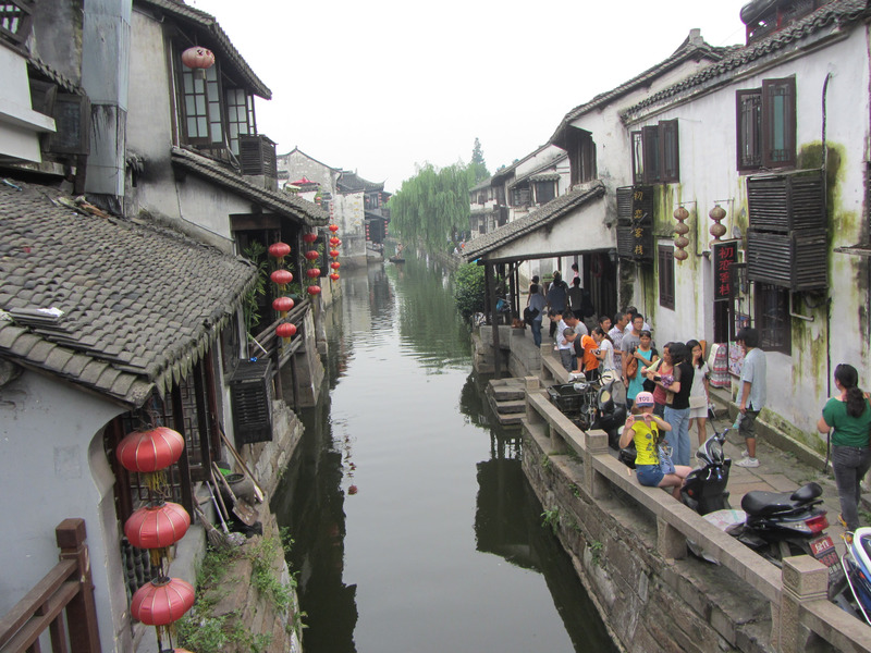 narrow canal surrounded by houses