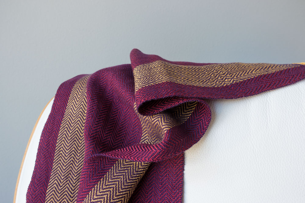 up-close view of scrunched-up purple and gold scarf