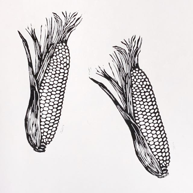 2 cobs of corn, printed in bold black ink on white paper.