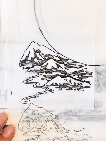 Fingers at bottom left hold down multiple layers of tracing paper. On the tracing paper are drawn mountains, streams, and tree branches, in either pen or pencil.