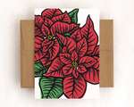 A single card with a brown envelope. The card depicts two red and green blockprinted poinsettia flowers.