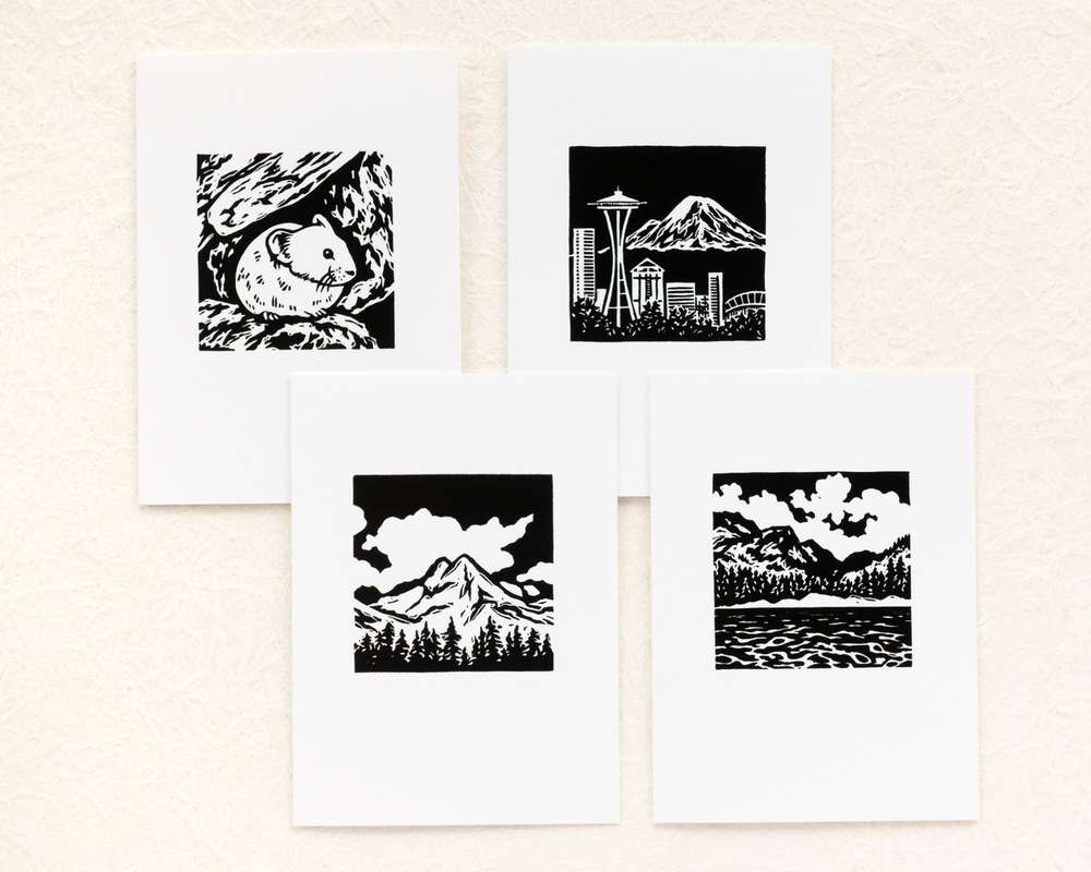 4 white cards with black and white images of PNW mountain scenes